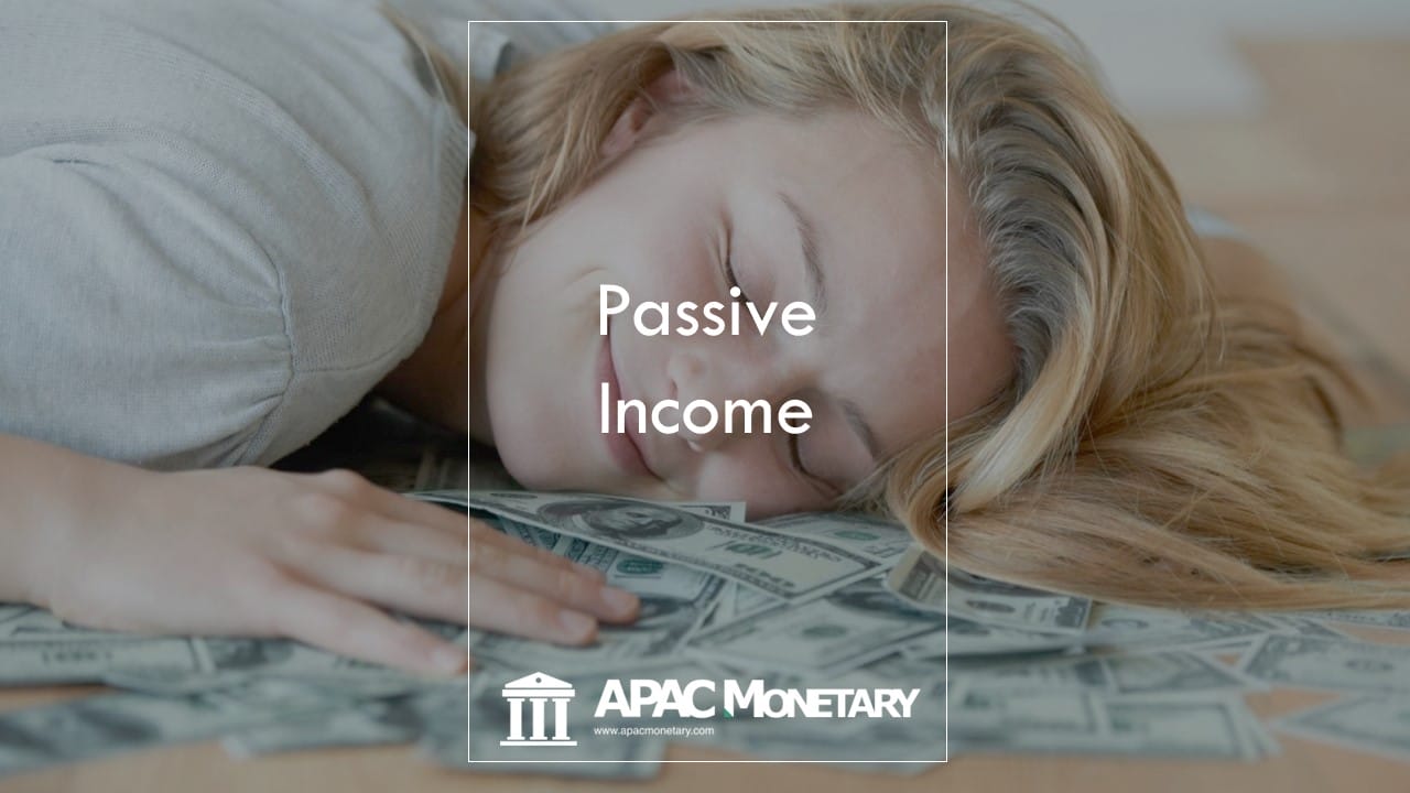 Australian lady sleeping on money while dreaming about what passive income is all about